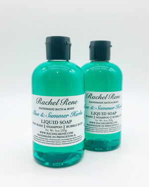 Two semi-transparent teal liquid soaps with white labels reading "Aloe & Summer Herbs." They have black pull-top caps and stand in front of a white background.