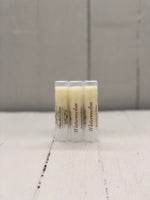 Watermelon flavored lip butter in a clear twist up round tube