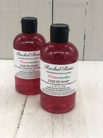 Watermelon scented liquid soap in a clear bottle with a black flip top cap