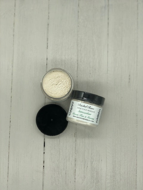 Light grey powder in a clear jar with a black lid labeled "Antioxidant Green Tea and Guava"