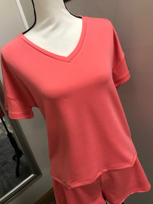 A coral v-neck short sleeve tee.