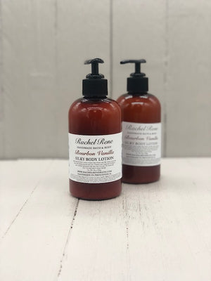 White lotion in an amber bottle with a black cap/pump. A white label reads "Bourbon Vanilla"