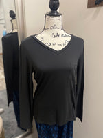 A black long sleeve v-neck with a pocket on the left breast.