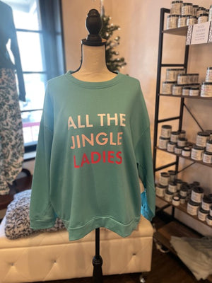 A light blue sweat shirt. Text reads, in white, "ALL THE", in pink, "JINGLE", in red, "LADIES".