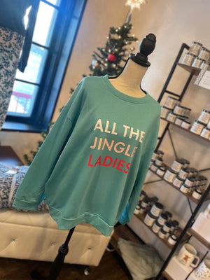 
            
                Load image into Gallery viewer, A light blue sweatshirt with text reading &amp;quot;ALL THE JINGLE LADIES&amp;quot;.
            
        