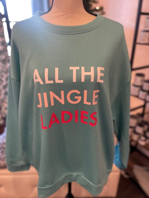 
            
                Load image into Gallery viewer, A light blue sweatshirt with text reading &amp;quot;ALL THE JINGLE LADIES&amp;quot;.
            
        