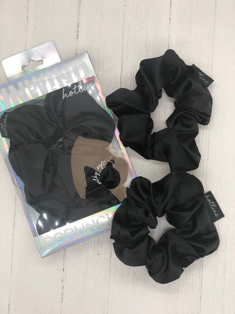 Two black silk scrunchies.