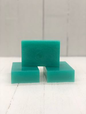 
            
                Load image into Gallery viewer, A teal rectangular soap bar.
            
        