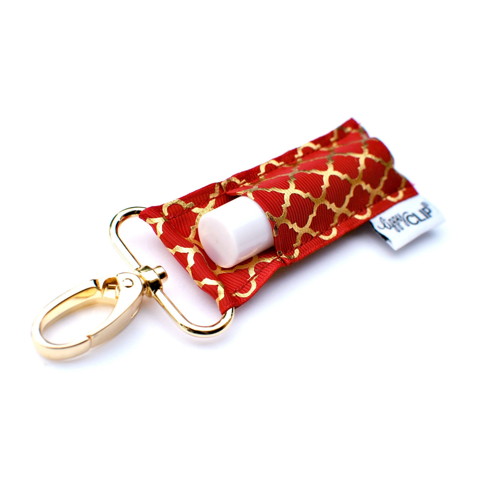 
            
                Load image into Gallery viewer, Gold Quatrefoil on Cranberry LippyClip® Lip Balm Holder
            
        